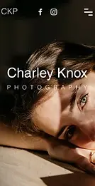 Mobile website of an online portfolio for a stylist and fashion designer, showing a redhead in glasses.